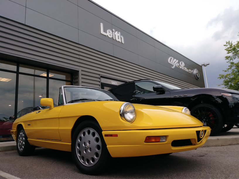 “Wow, isn’t she gorgeous?” A 1993 blazing yellow Alfa Romeo Spider Veloce, “the end of an era.”